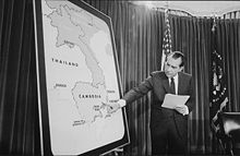 Richard Nixon pointing at a map of Cambodia