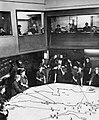 The Operations Room at RAF Fighter Command's No. 10 Group Headquarters, Rudloe Manor (RAF Box), Wiltshire, showing WAAF plotters and duty officers at work, 1943