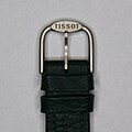 A buckle fastening for a leather watch strap.