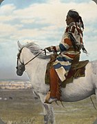 William Jackson (Little Blackfeet) on white horse, Siksika (Blackfoot), Montana. c. 1900s.