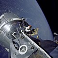 David Scott stands in the open hatch of Apollo 9