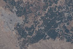 Aerial photo of the modern town of Firuzabad and the ancient circular city of Gor nearby