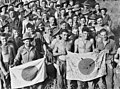 Image 24Australian soldiers display Japanese flags they captured at Kaiapit, New Guinea in 1943 (from History of the Australian Army)