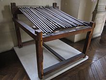 Photo shows a frame with a number of gun barrels placed side by side.