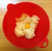 Eggs are added to mashed potatoes