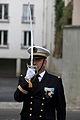 A Captain of Brest Naval Base presenting arms with his sabre
