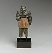 Monstrous male figure; late 3rd–early 2nd millennium BC; chlorite, calcite, gold, and iron; height: 10.1 cm; Metropolitan Museum of Art
