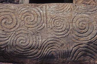 Neolithic spirals on the Newgrange entrance slab, unknown sculptor or architect, 3rd millennium BC