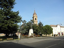 The central IV Novembre Square with the War Monument and the Saint Stephen church tower