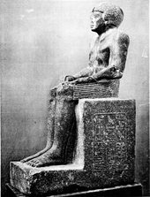 Statue of a seated man
