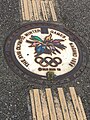 Tactile paving before and after a stylized 1998 Winter Olympics manhole cover in Nagano