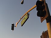 Internally illuminated mast-mounted street sign in Whittier, California