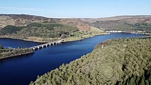 Photograph of part of the Ladybower Reservoir showing two road viaducts crossing the water