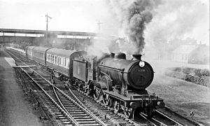 An LNER passenger train leaving March station in 1958