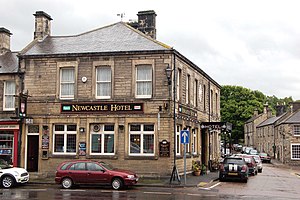Newcastle Hotel, on the junction of Front Street (B6341), foreground, and Church Street, right.