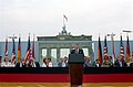 U.S. President Ronald Reagan, speaking before Brandenburg Gate on June 12, 1987, demands the Kremlin free Berlin and "Tear down this wall!"[43]