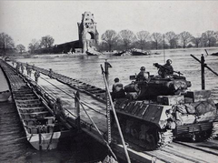 United States Army troops cross the Rhine on a heavy pontoon bridge during Operation Plunder, March 1945[1]