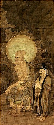 Painting of a tall, older man sitting, with an earring. His head is surrounded by an aura, and there is a short bearded man, wearing a headpiece, standing next to him.