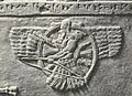 A Neo-Assyrian relief of Ashur as a feather robed archer. It appears on the Assyrian flag.