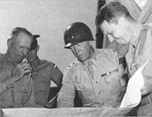 McNair confers with George Patton and others at Desert Training Center