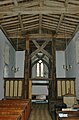 The west end of the nave in St Mary the Virgin parish church, showing the scissor-braced 15th-century frame supporting the bell-turret