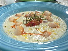 A cream-style seafood chowder prepared with scallops and corn