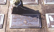 a plaque of a grave headstone
