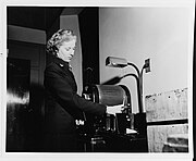 WAVE Y3c Harriette Heyman operating a ditto machine, 1943