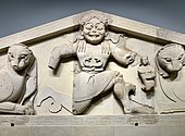 Fig. 6. Winged snake-haired Gorgon (Medusa) with belt of snakes, in kneeling-running position, with her offspring Pegasus (left) and Chrysaor (right) at her side, and flanked in Mistress of Animals style by a pair of lions; pediment from the temple of Artemis in Corfu, Archaeological Museum of Corfu (early sixth century BC)[63]