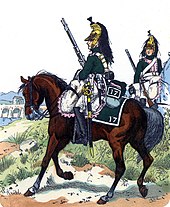 Colored print shows two French mounted dragoons of the 17th Regiment in 1812. They wear green coats with white breeches and brass helmets.