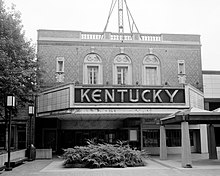 Black and white photograph showing the facade of a performing arts building with a large sign reading "Kentucky"