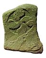 A lauburu carved into a stone.