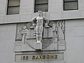 Stackpole's heroic figures were direct-carved in situ on a scaffold over the entrance of the Stock Exchange Tower[20]