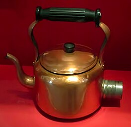 Swan electric kettle in brass, an early electric kettle at the Museum of Liverpool