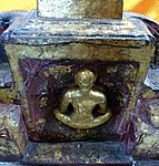 Relief on the base of a Buddhist statue