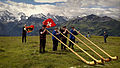 Image 26Some of the traditional symbols of Switzerland: the Swiss flag, the alphorn and the snow-capped Alps (from Culture of Switzerland)