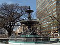 Fountain at the intersection with Cordoba Avenue. Behind it, the former headquarters of FIAT Argentina