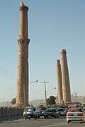 Traffic passing on road near the Herat minarets, 2005.