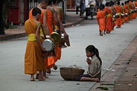 Monks collecting alms at dawn