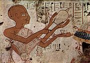 Egyptian tomb painting of a mortuary priest offering libation (1298–1235 BCE)