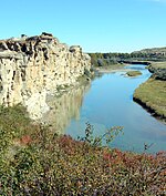 Sandstones of the Milk River Formation flank the Milk river at Writing-on-Stone Provincial Park, Alberta.