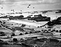 Image 8 Invasion of Normandy Photo credit: United States Coast Guard Landing ships putting ashore on Omaha Beach at low tide during the first days of the Invasion of Normandy, mid-June, 1944. Barrage balloons fly overhead and U.S. Army "half-tracks" form a convoy on the beach. The Normandy landing was the largest seaborne invasion in history, with almost three million troops crossing the English Channel. More featured pictures