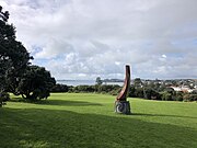 Takaparawha Pou (pole or column) installed at Takaparawhau (Bastion Point) in 2019, designed by Lenard Philips and Te Aroha Witika. The pou has the shape of a taurapa (the stern of a waka) standing on a concrete plinth representing the toka (rock) that acted as a beacon for waka, known as Bastion Rock.[31]
