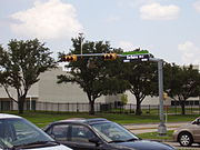 A street sign in Westchase branded by the management district.