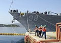 Greek line handlers assist as Arleigh Burke-class guided-missile destroyer USS Forrest Sherman (DDG-98) arrives in Greece for the first port visit of her maiden deployment.