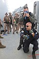 Greek Navy Warrant Officer Alexander Tsaltas demonstrates tactical sweep techniques for U.S. Marines with the 26th Marine Expeditionary Unit's maritime interception operations assault force aboard the training ship HNS Aris in Souda Bay, Crete, Greece