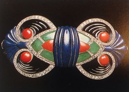 Boucheron (1925), a gold buckle set with diamonds and carved onyx, lapis lazuli, jade, and coral (Museum of Decorative Arts, Paris)
