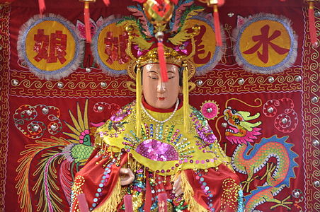 Statue of a Chinese goddess Shui Wei Sheng Niang during a procession for the Lunar New Year in Paris.