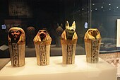 Complete set of canopic jars decorated with hieroglyphics; 744–656 BC; painted sycomore fig wood; various heights; British Museum (London)