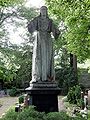 Christusfigur von Michel Lock auf dessen Grab